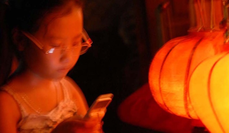 girl glasses phone lantern.jpg