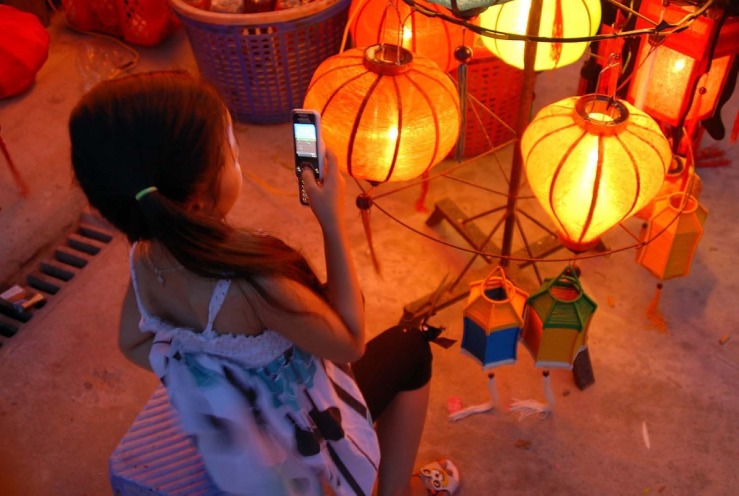 girl w phone lanterns 1.jpg