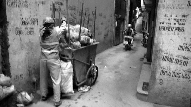 trash collector in alley.jpg