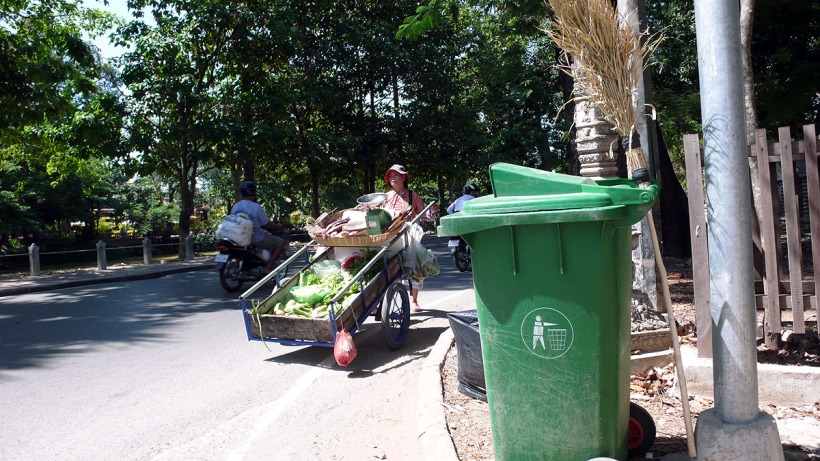 woman cart street trash.jpg
