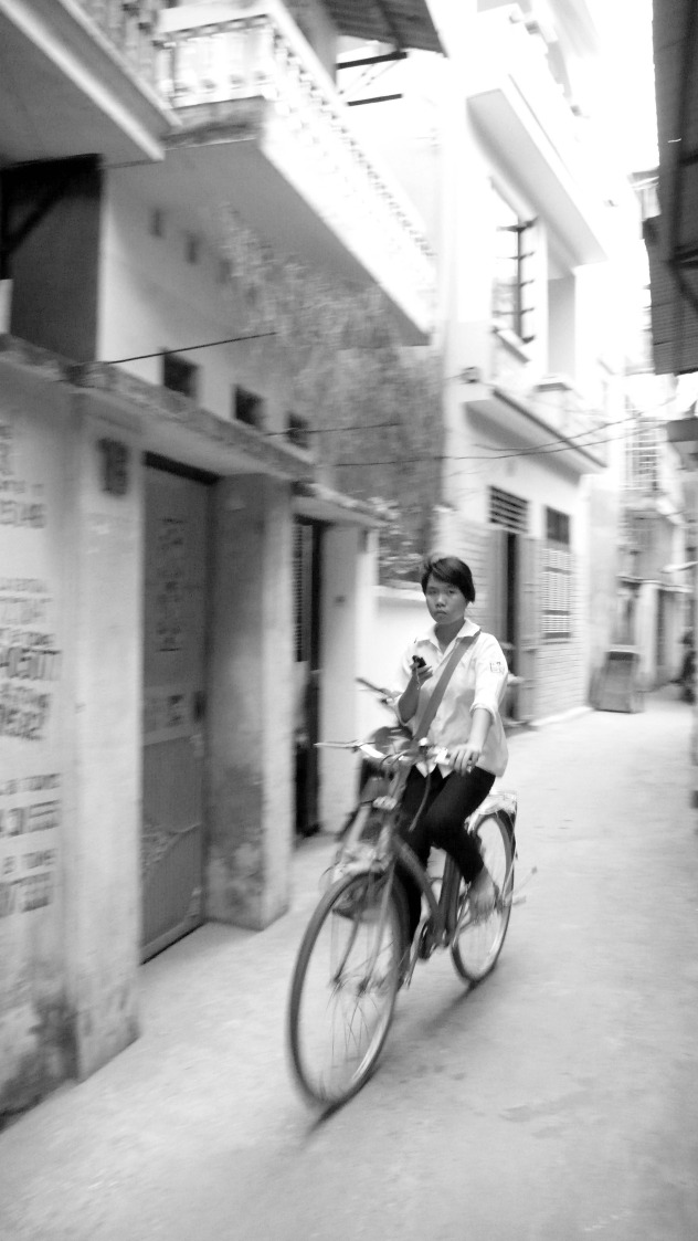 girl bike alley cell.jpg