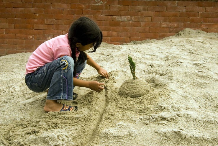 girl plays in sand.jpg
