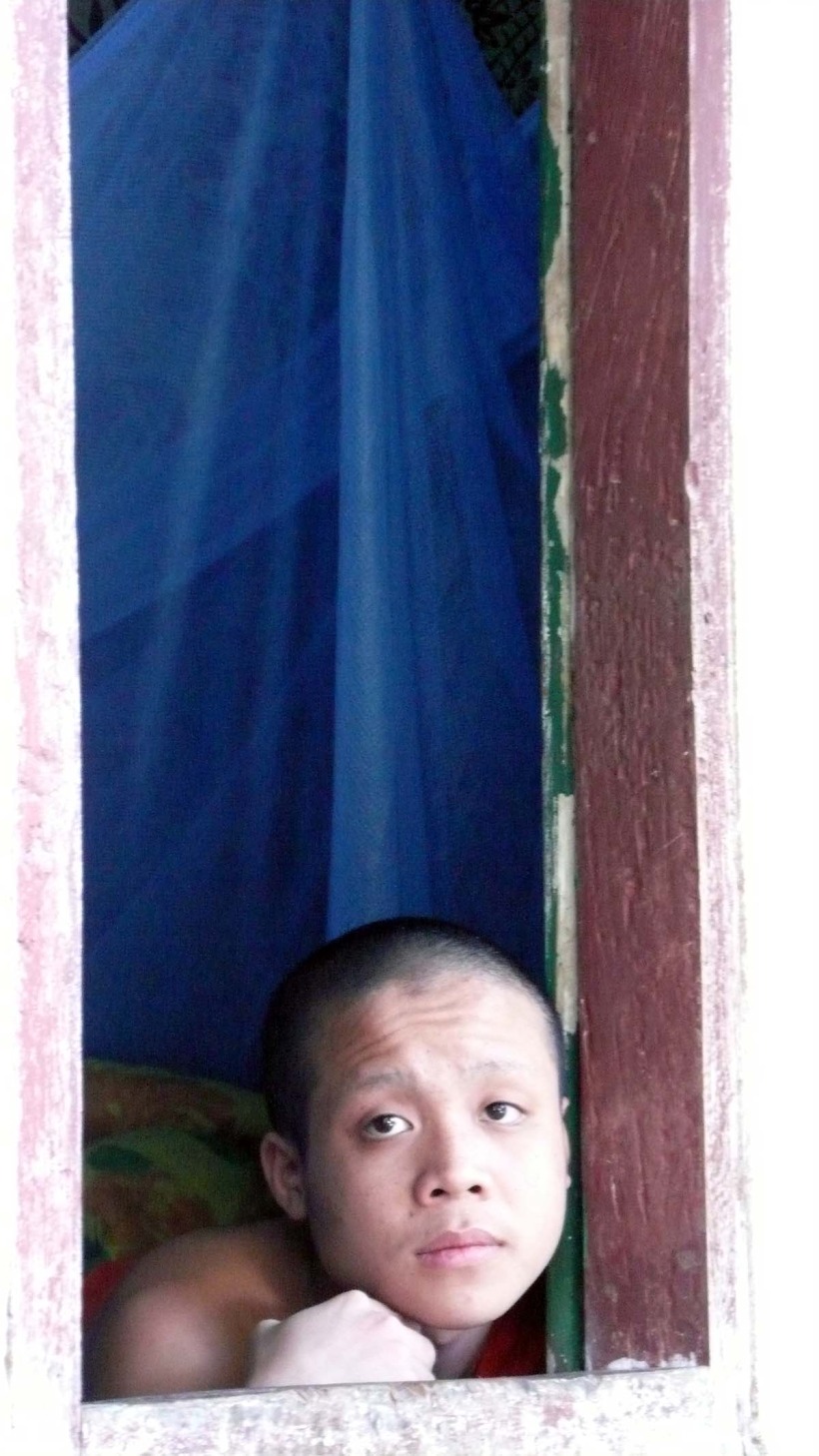 sad eyed monk in window.jpg