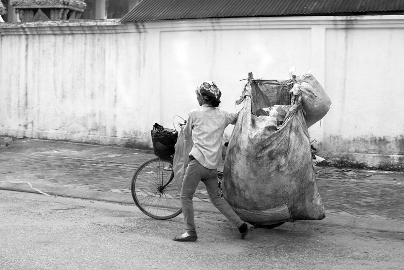 woman bike trash.jpg