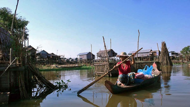 woman in red poling boat.jpg