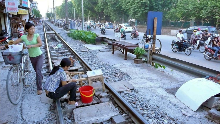 woman works on train tracks.jpg